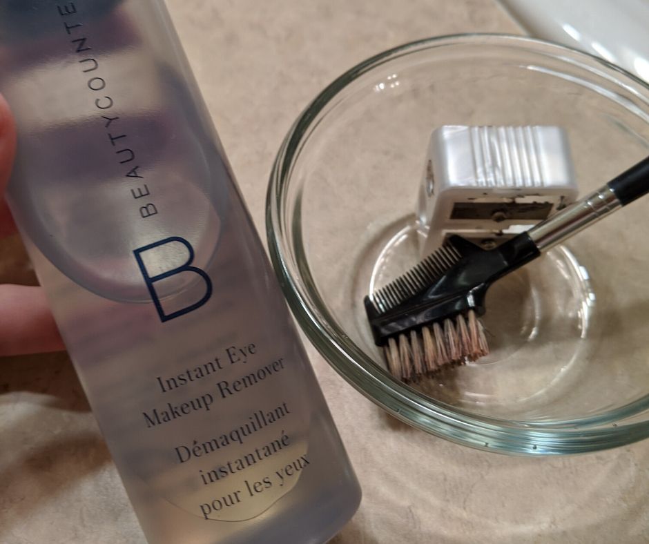 Makeup remover, bowl, and lash brush.